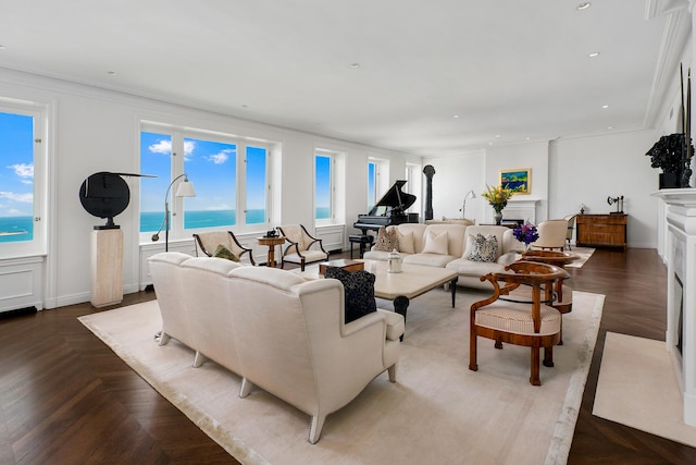 living room with crown molding, recessed lighting, a fireplace, and baseboards