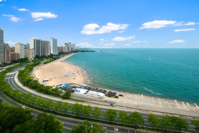 property view of water featuring a view of city and a beach view