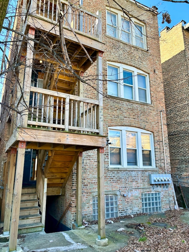 rear view of property featuring central AC