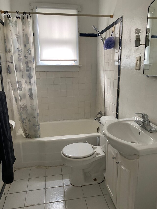 full bathroom featuring vanity, toilet, shower / tub combo with curtain, and tile patterned flooring