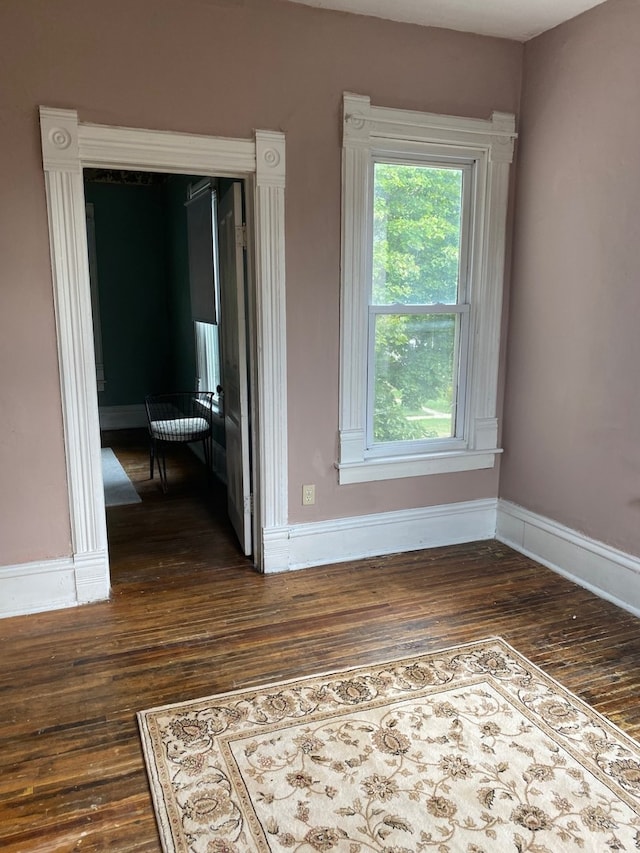 627 Hennepin St, Lasalle, IL 61301 - unfurnished room with baseboards and dark wood-style floors