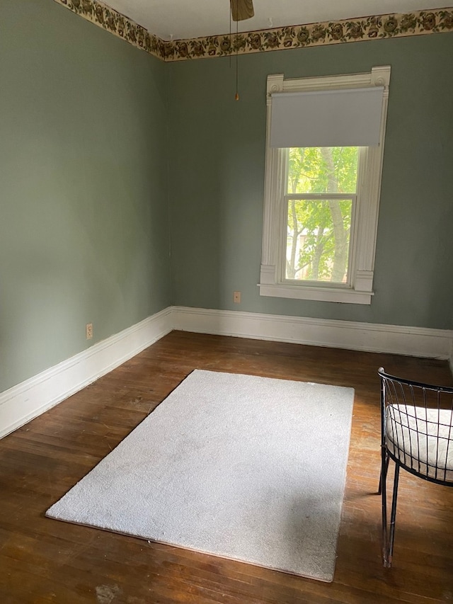 627 Hennepin St, Lasalle, IL 61301 - spare room featuring a ceiling fan, baseboards, and wood finished floors