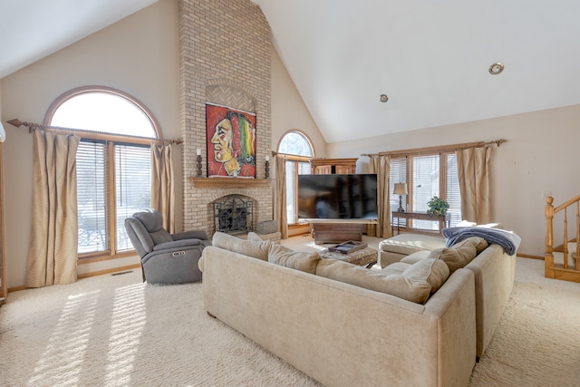 carpeted living room with high vaulted ceiling, a wealth of natural light, and a brick fireplace