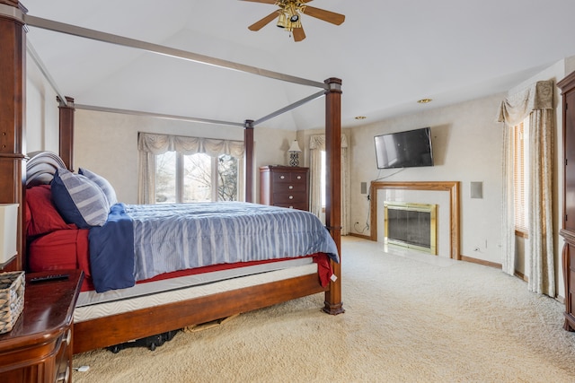 carpeted bedroom with lofted ceiling and ceiling fan