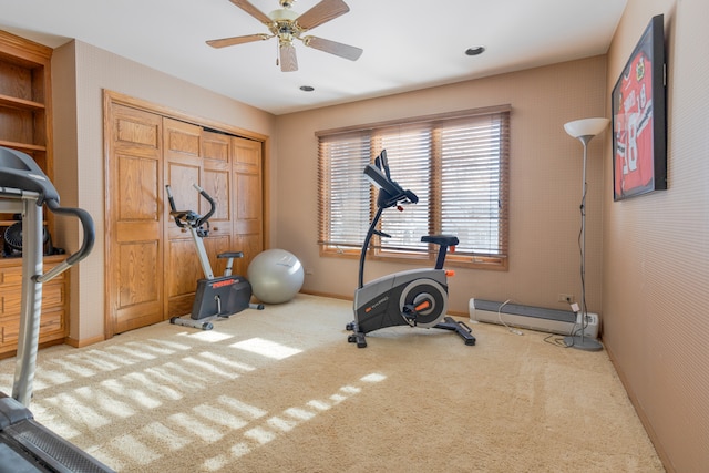 workout area featuring ceiling fan and carpet floors