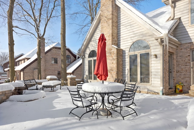 view of snow covered patio