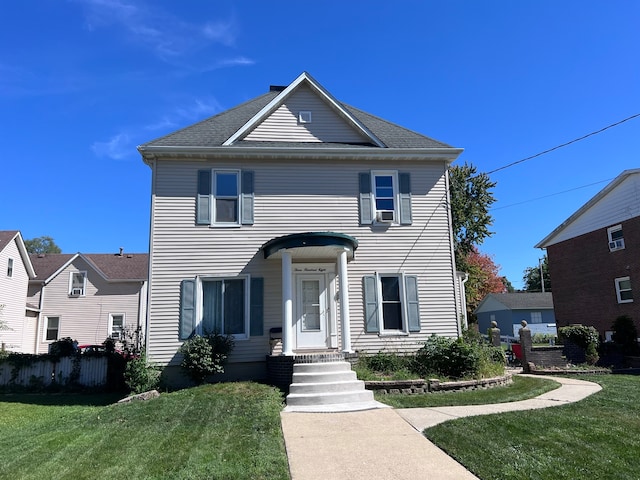 view of front of property with a front lawn