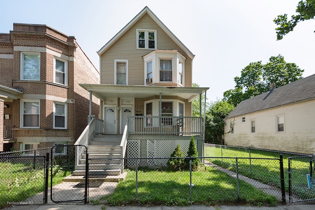 view of front of home with a front lawn and covered porch