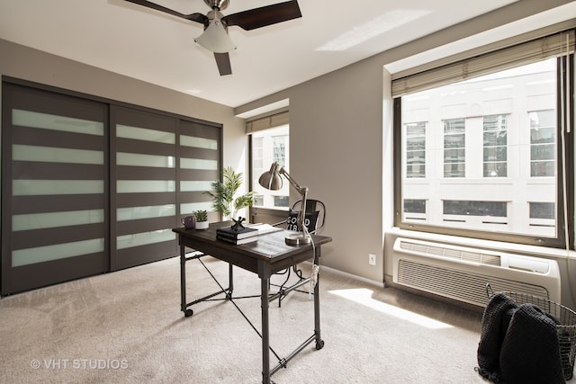 carpeted home office with ceiling fan