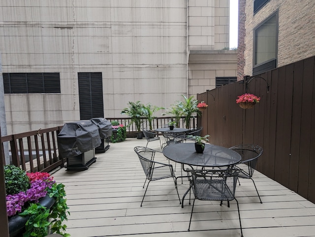 wooden terrace featuring area for grilling