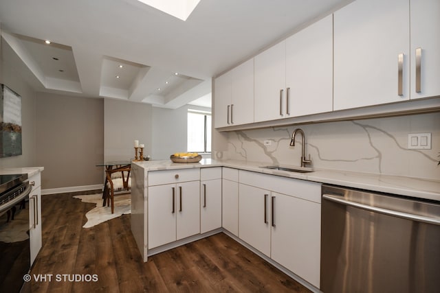 kitchen with dishwasher, light stone counters, sink, and dark wood-type flooring