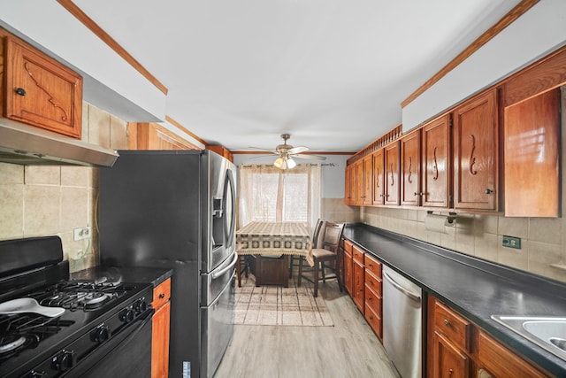 kitchen featuring black gas stove, decorative backsplash, light hardwood / wood-style floors, stainless steel dishwasher, and ceiling fan