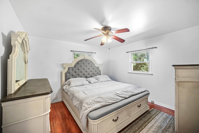 bedroom featuring dark wood-type flooring and ceiling fan