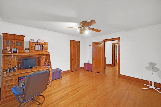 home office featuring ornamental molding, light wood-type flooring, radiator heating unit, and ceiling fan