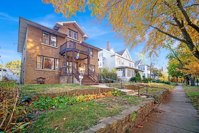 view of front of house featuring a balcony