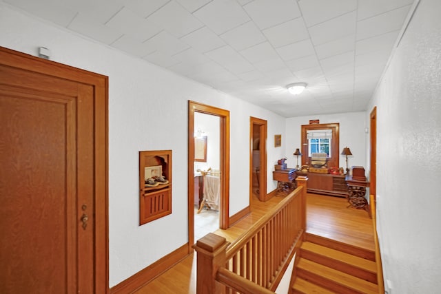 hall with light hardwood / wood-style flooring