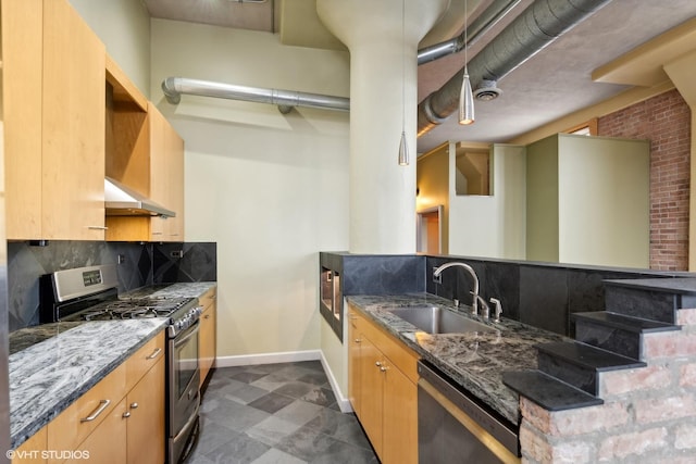 2675 W Grand Ave Unit 302, Chicago, IL 60612 - kitchen featuring appliances with stainless steel finishes, a sink, baseboards, stone counters, and tasteful backsplash