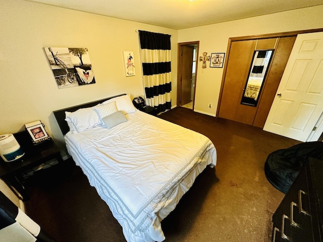 bedroom featuring dark colored carpet