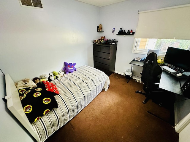 bedroom featuring carpet floors, baseboards, and a desk