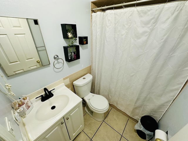 bathroom featuring toilet, tile patterned flooring, vanity, and a shower with shower curtain