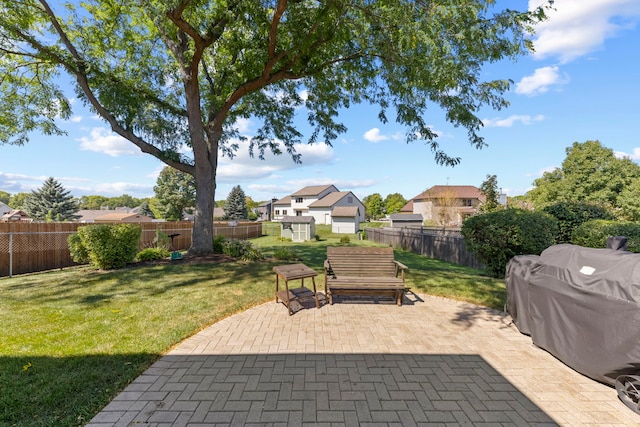 view of patio / terrace with a storage shed