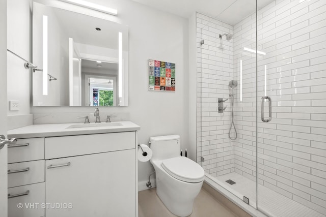 full bath featuring vanity, a shower stall, and toilet