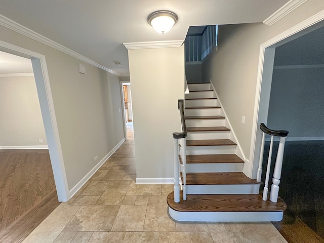 stairway featuring crown molding and hardwood / wood-style floors