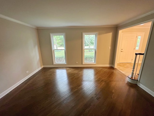 unfurnished room with crown molding and dark hardwood / wood-style flooring