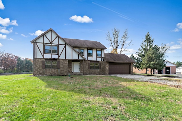 view of front facade with a front yard and a garage