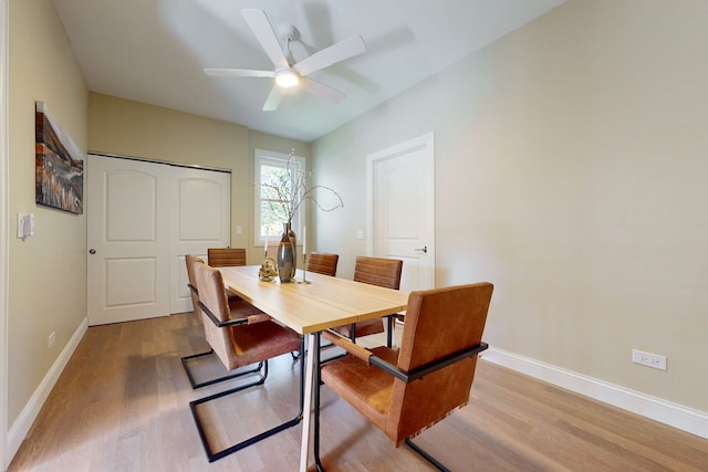 dining room with light wood-type flooring and ceiling fan