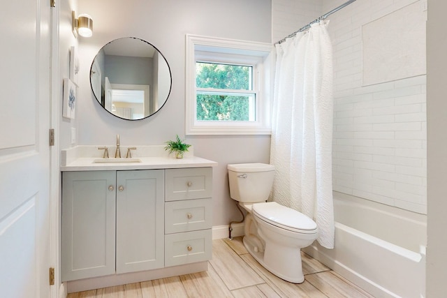 full bathroom featuring shower / bath combination with curtain, vanity, and toilet