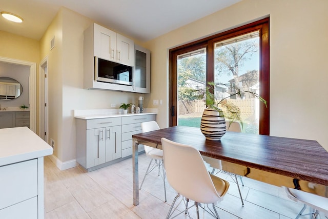 dining space featuring light tile patterned floors