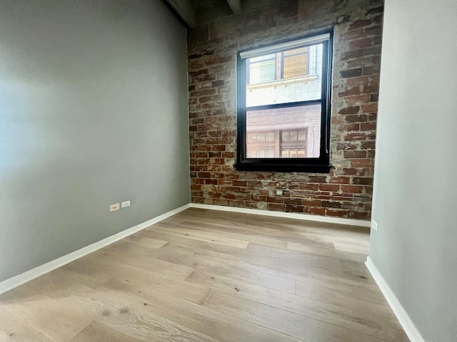 spare room featuring light hardwood / wood-style flooring