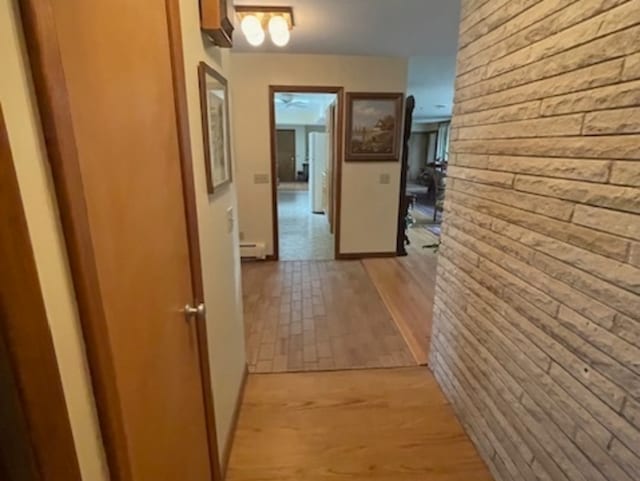 hallway featuring light hardwood / wood-style floors and a baseboard radiator