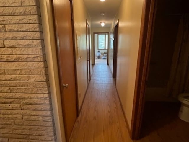 corridor featuring light hardwood / wood-style floors