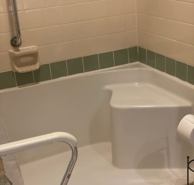 bathroom featuring a tub to relax in