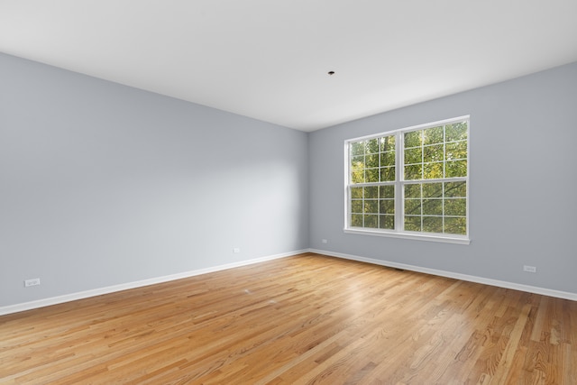 empty room with light hardwood / wood-style floors