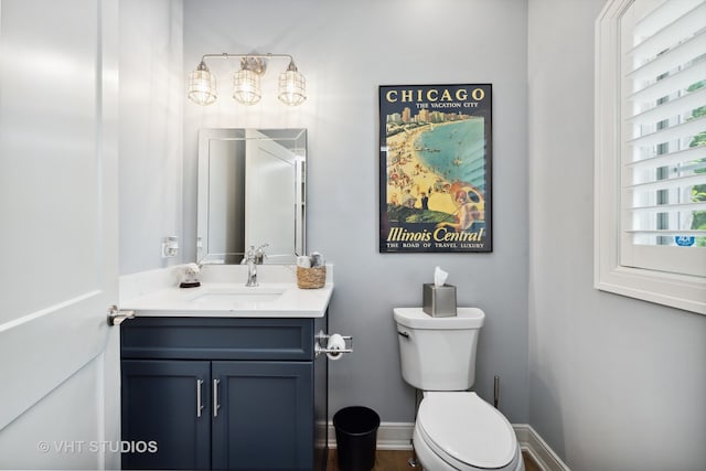 bathroom featuring toilet and vanity