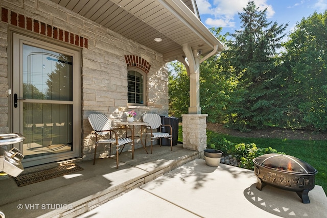 view of patio / terrace featuring a fire pit