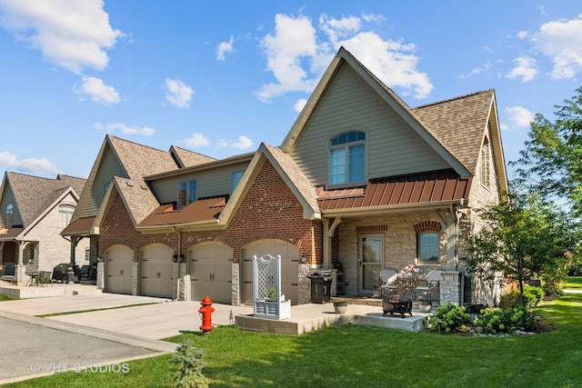 back of property with a garage and a lawn