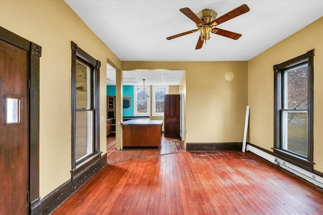 spare room featuring ceiling fan and dark hardwood / wood-style floors