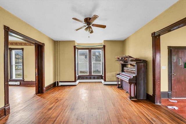 miscellaneous room with hardwood / wood-style flooring and ceiling fan