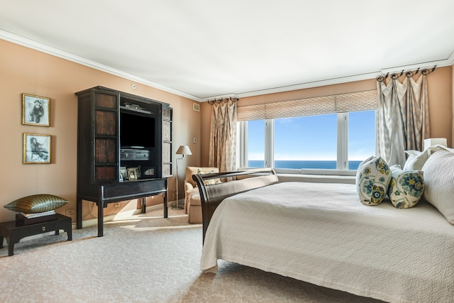 carpeted bedroom with ornamental molding