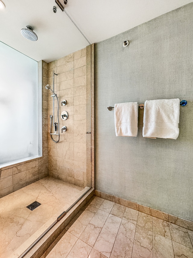 bathroom with a tile shower