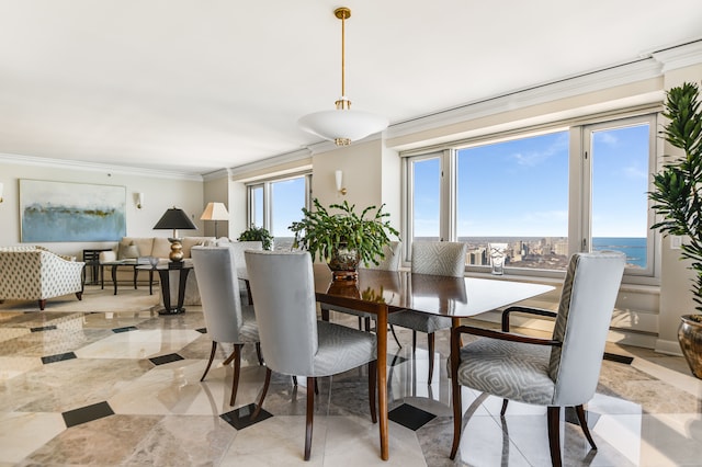 dining area featuring a water view and ornamental molding