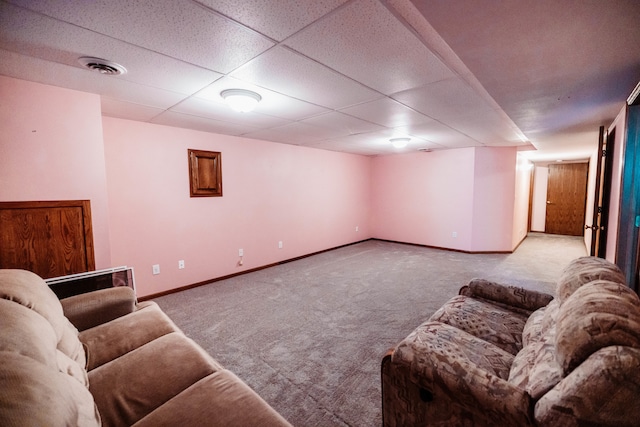 living room with carpet and a drop ceiling