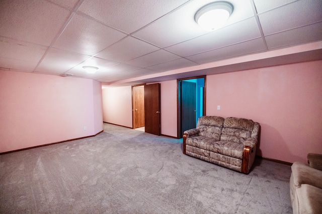 unfurnished room featuring a paneled ceiling and carpet