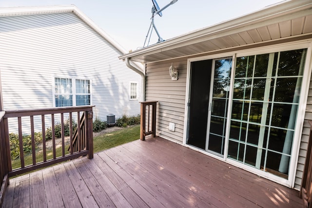 wooden deck featuring central air condition unit