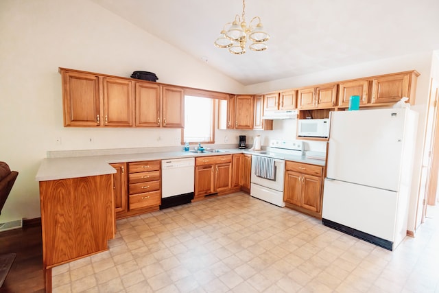 kitchen with an inviting chandelier, decorative light fixtures, white appliances, sink, and high vaulted ceiling