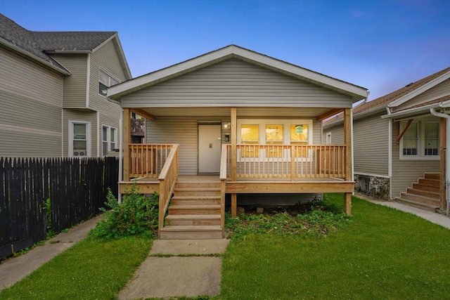 view of front facade featuring covered porch and stairs